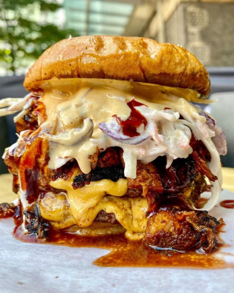 Dripping beef burger with coleslaw and cheese