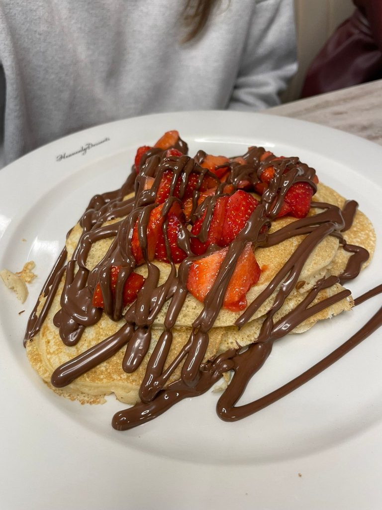 Pancakes with strawberries and chocolate sauce